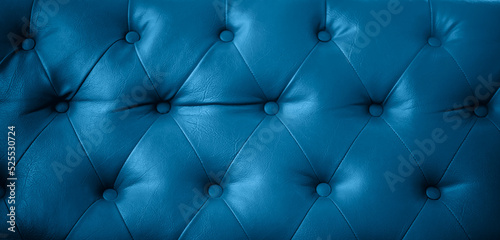 Close up texture of dark blue leather sofa retro style can be use as background 