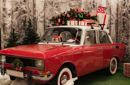 red car with gifts on the roof for christmas and new year, santa claus car, christmas car travel, delivery on time,