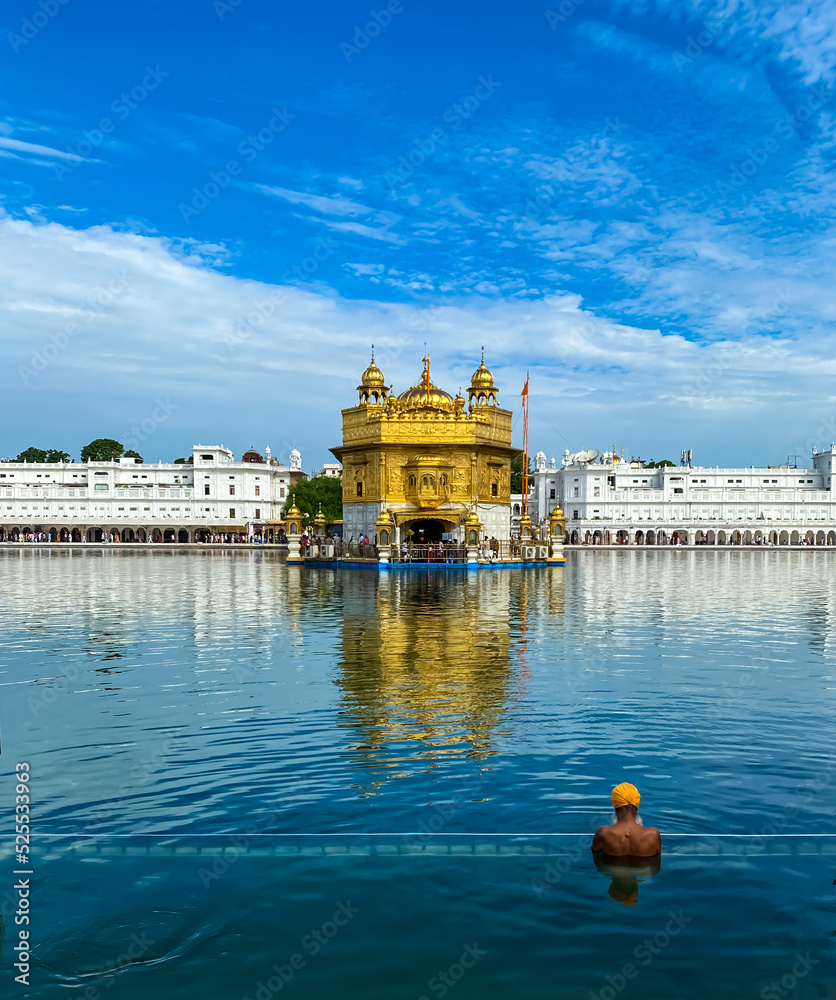 A piligrim taking holy bath in the holy pond of Golden Temple Amritsar Punjab India Stock Photo