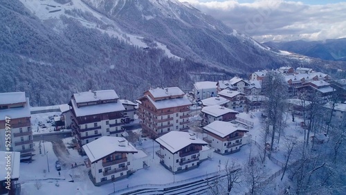 Winter aerial view of the Olympic mountain village Roza Plato. Beautiful winter landscape from drone.