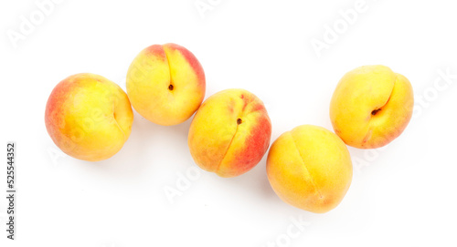 Fresh peaches on a white background, red-yellow apricots.