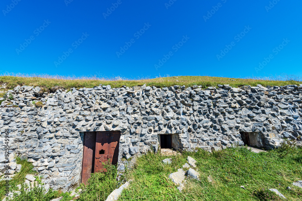 Fortress or bunker of the second world war, Trekking footpath to the Mountain Peak of Osternig or Oisternig, Carnic Alps, Italy Austria border, Europe. Tarvisio, Udine province, Friuli Venezia Giulia. Fortress or bunker of the second world war, Trekking footpath to the Mountain Peak of Osternig or Oisternig, Carnic Alps, Italy Austria border, Europe. Tarvisio, Udine province, Friuli Venezia Giulia.