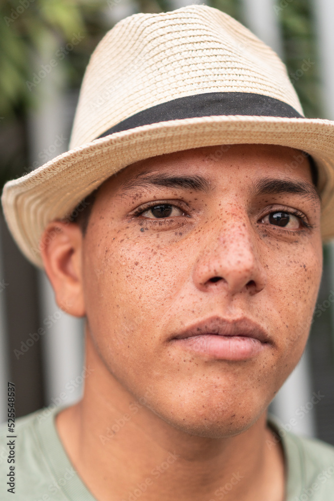 Freckled man wearing a hat on the street Freckled man wearing a hat on the street