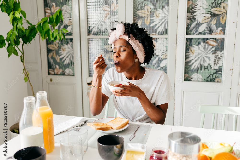 African American woman having breakfast at home African American woman having breakfast at home