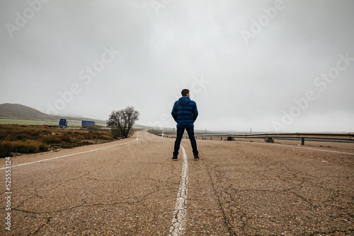 Traveler in the middle of the road