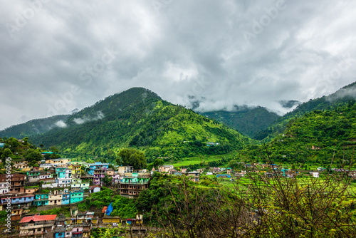 A wide angle shot of a village in the mountains of Lower Himalayan region of Uttarakhand State, India.