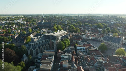 Panoramic View Of Gouda Cityscape With Historical Churches And Buildings In South Holland, Netherlands. Aerial Drone Shot photo