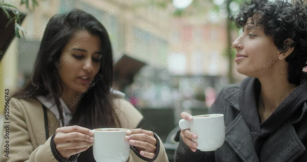 MS Female couple drinking coffee MS Female couple drinking coffee