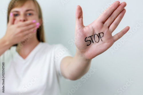 Crying showing a stop sign with her hand photo