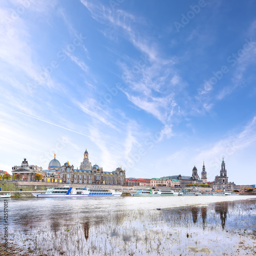 Sunset on Elbe river with panorama of Cathedral of the Holy Trinity or Hofkirche, Bruehl's Terrace or The Balcony of Europe