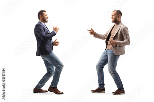 Full length profile shot of two young professional men dancing