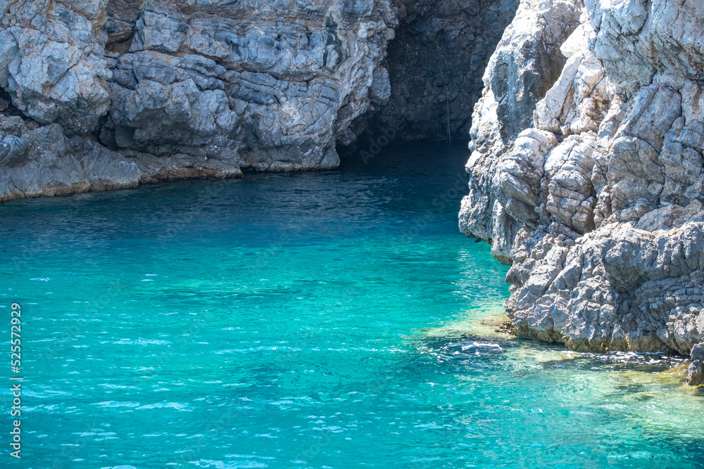 Cave on A Rocky Cliff on Aegean Sea.