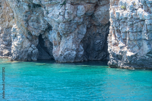 Cave on A Rocky Cliff on Aegean Sea.