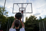 Man is throwing ball to the hoop. Training of basketball