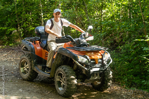 man quad bike in the forest