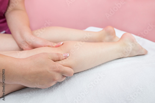  Anti-cellulite foot massage in spa salon.