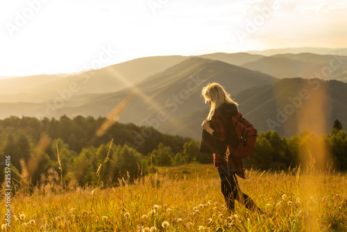 Freedom traveler woman on the top of mountains enjoy a wonderful nature. Yound girl on peak mountain with perfect view mountains. travel concept