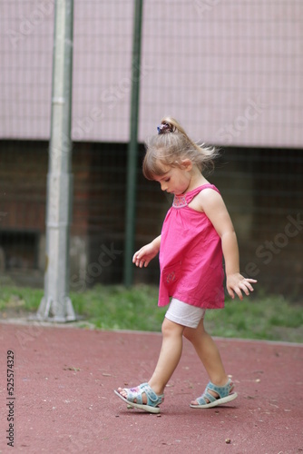 portrait of a little child in a pink dress in sofia bulgaria  © Marius