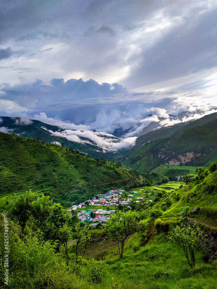 A wide angle shot of a village in the mountains of Lower Himalayan region of Uttarakhand State, India.