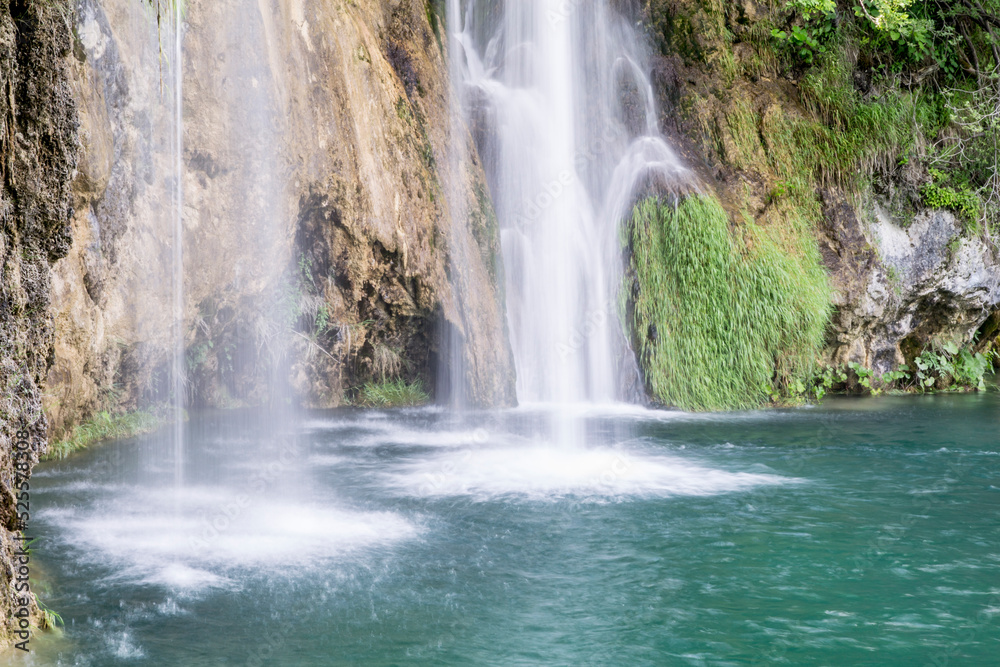 Fototapeta premium Beautiful paradise. Blue lake and cascade in the forest, Plitvice lakes, Croatia.