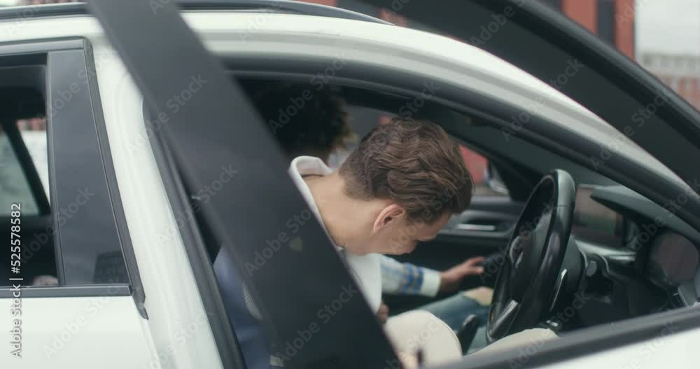 MS Young male couple getting in car