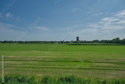 Panoramic view of a classic polder landscape and a village in the western part of the Netherlands