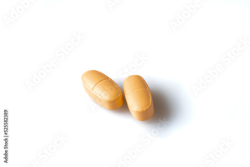 Image of orange pills isolated with shadows