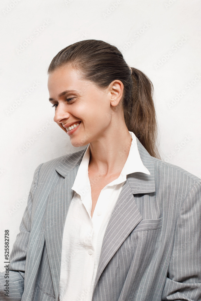 Caucasian Girl in business style laughs showing her teeth, emotional confident female Caucasian Girl in business style laughs showing her teeth, emotional confident female