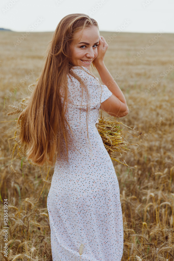 Beautiful woman in rye field wearing white dress. Rural lifestyle Beautiful woman in rye field wearing white dress. Rural lifestyle