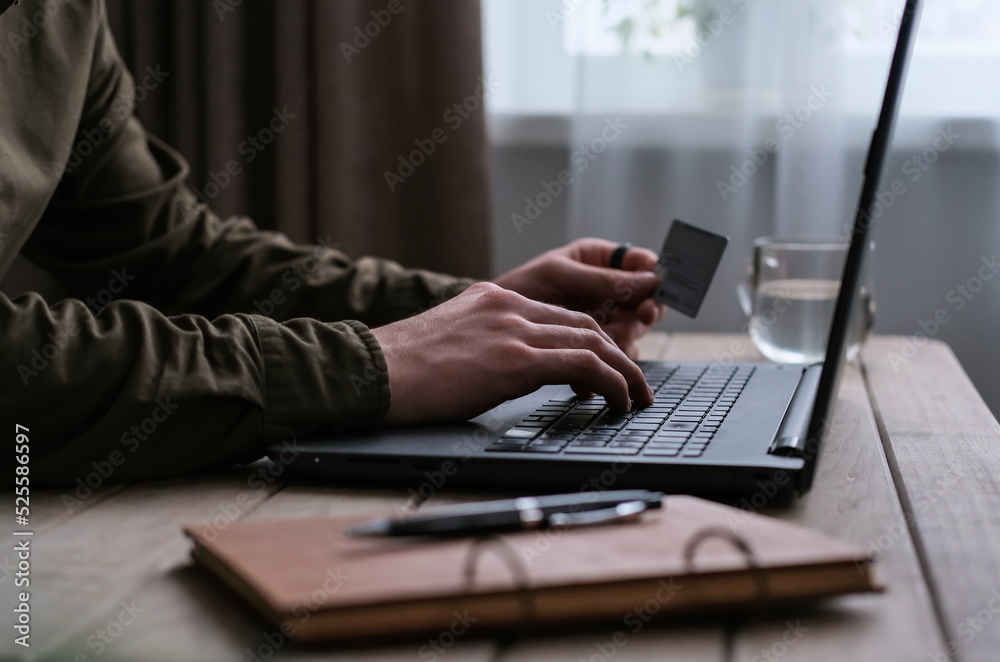 Young man shopping online, send online payment with credit card Young man shopping online, send online payment with credit card