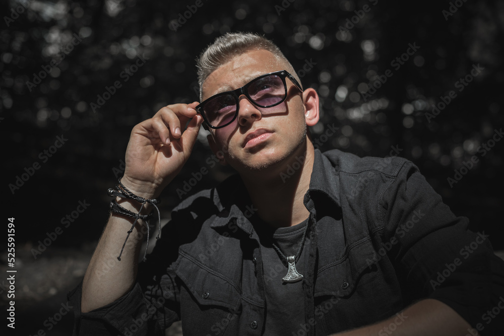 Obraz premium Young European man with a sad philosophical mood. The concept of life, problems and depression. Crisis of young age
