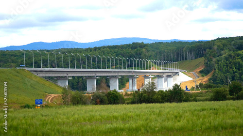 Automobile bridge across the Amur Bayou to Bolshoy Ussuriysky Island. Filmed on the border of Russia with China. Far Eastern region of Russia, Khabarovsk, Bolshoy Ussuriysky Island.