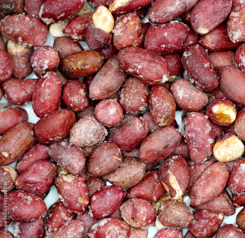 unpeeled roasted salty peanuts background unpeeled roasted salty peanuts background