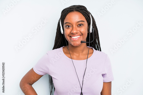 black pretty woman smiling happily with a hand on hip and confident. telemarketer concept