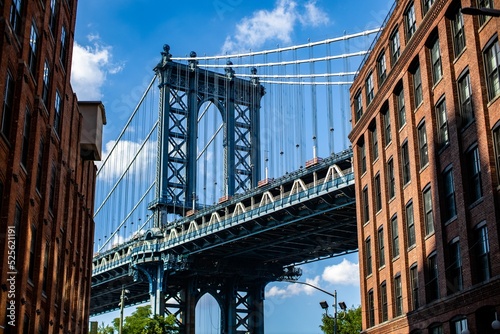 Photography Beautiful low angle shot of the Manhattan Bridge in New York City under a bright