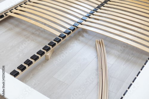 assembly of a double bed made of wood and lamella