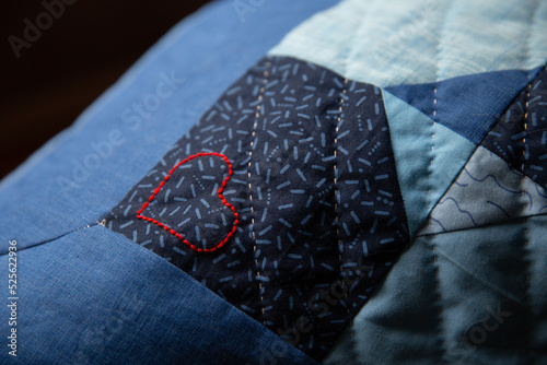 hand sewn red heart of blue quilt