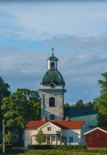 Vertical view of the Rattvik Church under the cloudy sky in Sweden photo