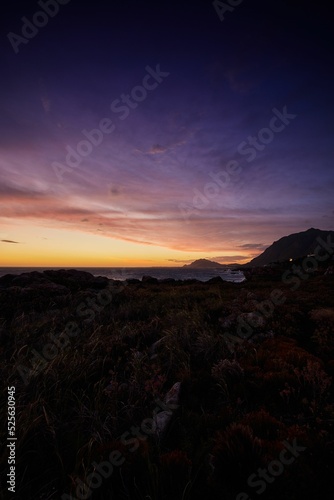 Canvas Print Vertical shot of the sunset over Betty's bay in Western Cape in South Africa