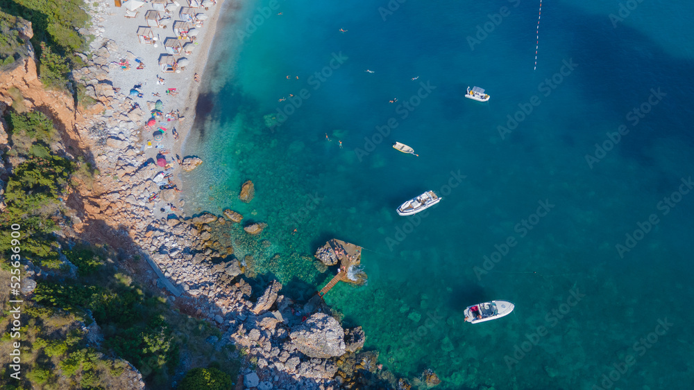 aerial view. sea, beautiful blue, ships in the sea, rocks and lush greenery, people enjoying the beach