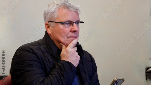 Fotografie Old Caucasian man looking worrying anxiously
