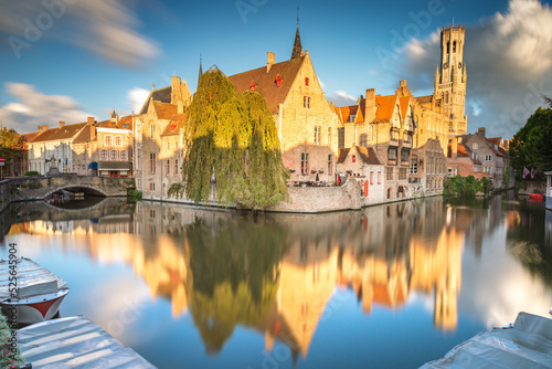 Rozenhoedkaai canal reflection at sunrise and blurred clouds  Bruges