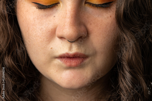 Close up of young woman puckering her lips.