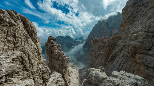 Fotografie climbing the via ferrata via delle bocchette mountain sign in the brenta Dolom