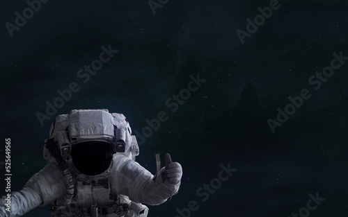 Fototapeta Naklejka Na Ścianę i Meble -  Astronaut on background of deep space nebulae. Science fiction. Elements of this image furnished by NASA