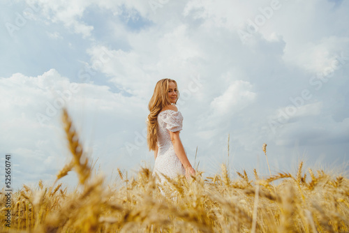 Summer woman portrait in rural countryside in wheat field