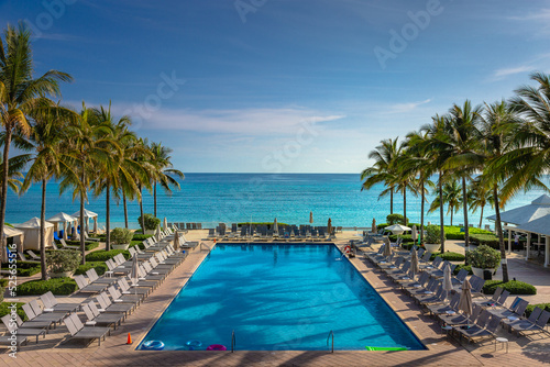 Fototapeta Naklejka Na Ścianę i Meble -  Tropical paradise: beach with pool, gazebos and palm trees, Montego Bay, Jamaica