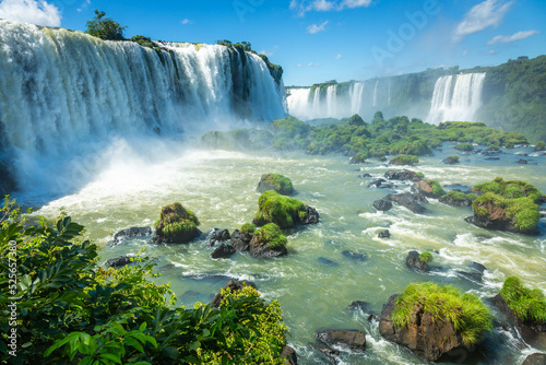 Dramatic Iguacu falls in southern Brazil at sunny day photo
