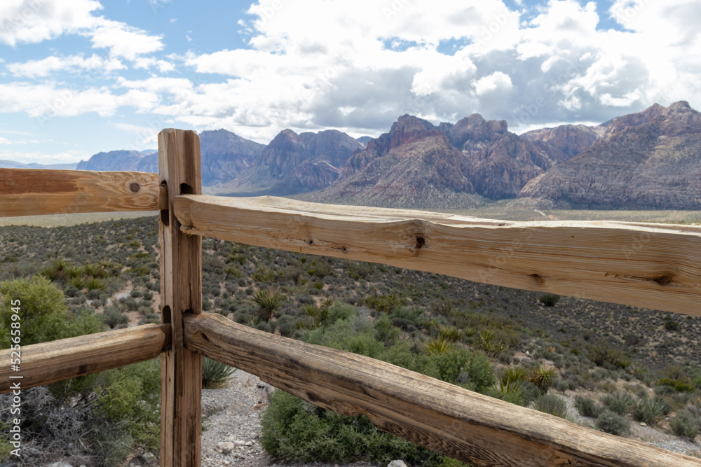 View from behind a fence of the desert and mountains in Las Vegas, Nevada