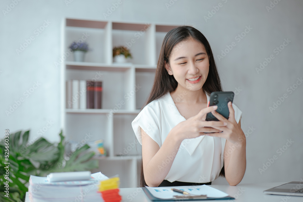 Young beautiful woman is texting and chatting with friends on smartphone at home Young beautiful woman is texting and chatting with friends on smartphone at home